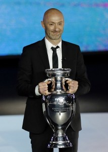 Former-French-goalkeeper-Fabien-Barthez-holds-the-Euro-trophy-at-the-draw-in-Nice.-AFPpic-214x300