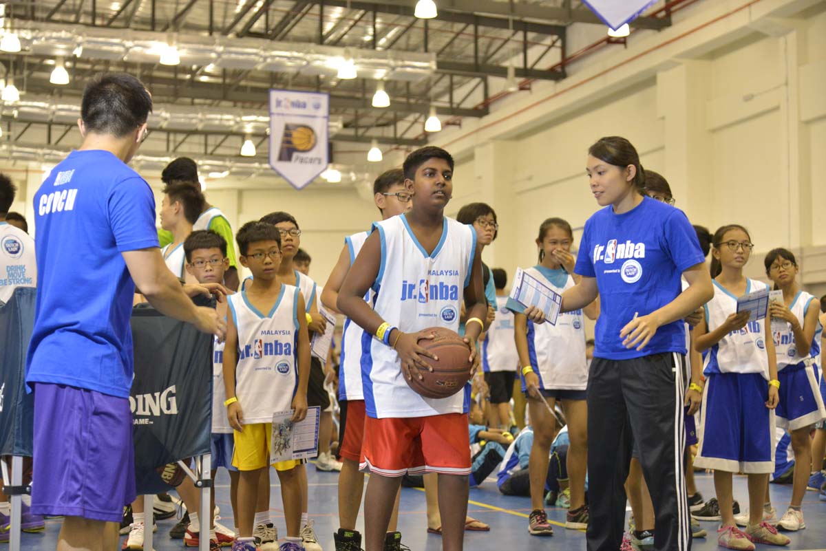 Participants going through the warmup session at the Jr. NBA Malaysia 2016 presented by Dutch Lady Regional Selection Camp.